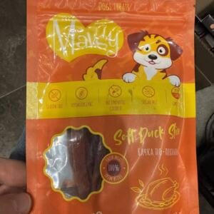 Пакет з ласощами для собак з написом 'Soft Duck Slice' і зображенням собаки.