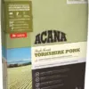 Пакет корму для собак ACANA з написом "Yorkshire Pork" та зображенням полів на фоні.